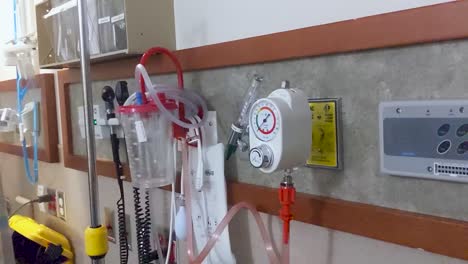 Slow-pan-across-a-hospital-wall-full-of-instruments-ready-to-be-used-on-a-patient