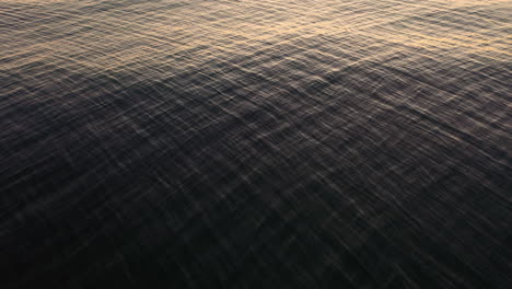 Abstract-Texture-Of-Ocean-With-Rippling-Water-During-Sunset