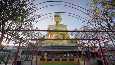 4k-Panning-backward-from-a-golden-statue-of-a-monk-Luang-Pu-Thuat