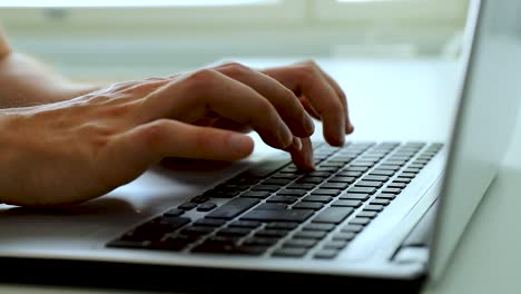 Close-up-of-hands-typing-with-a-laptop