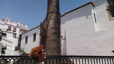 a-redhead-woman-walking-on-a-typical-town-in-the-Canary-Islands