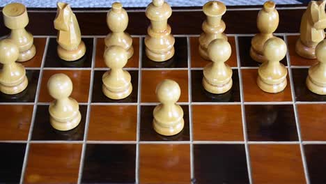 Wood-chessboard-and-wooden-chess-pieces