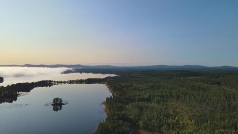 Misty-Landscape-In-Dalarna,-Sweden-In-The-Afternoon---aerial-shot