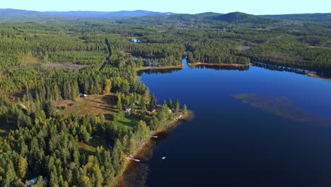 Picturesque-Landscape-Of-Green-Forest-And-Blue-Lake-Siljan-In-n-Dalarna-Sweden---aerial-shot