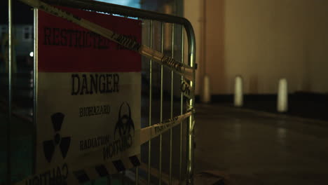 Danger,-restricted-access-biohazard-sign-at-night