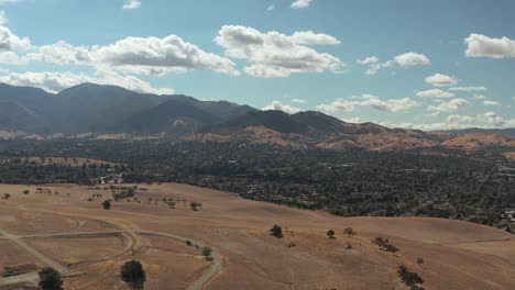 Aerial-shot-of-California-countryside-with-hills-with-perfect-blue-skies-and-clouds,-Concord-CA