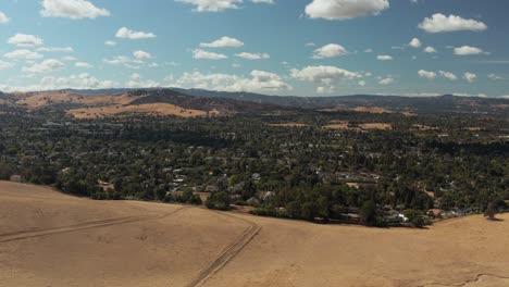 Aerial-shot-of-California-countryside-with-hills-with-perfect-blue-skies-and-clouds,-Concord-CA