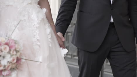bride-and-groom-holding-hands