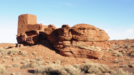 Parallax-shot-of-ruined-building-built-on-sandstone-rock-formation