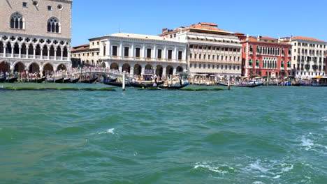Doge-Palace,-Grand-Canal,-and-hotels-in-Venice-Italy-from-boat,-HD