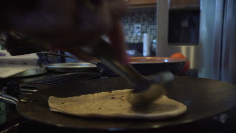 Cooking-roti-on-the-stove-top