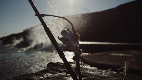 Fishing-pole-with-wave-splashing-in-background