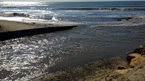 San-Juan-Creek-river-mouth-polluted-storm-runoff-into-Capistrano-Beach-Pacific-Ocean,-HD,-static