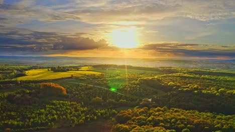 Stunning-dramatic-aerial-view-of-Yorkshire-countryside-woods-and-fields,-England