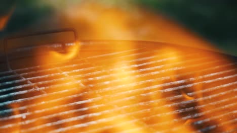 Close-up-of-a-grill-with-dancing-hot-fire-flames