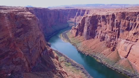 Aerial-shot-of-a-river-running-through-a-canyon