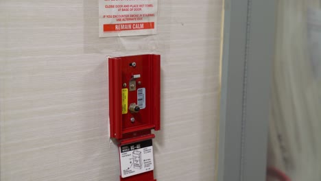 Pulling-fire-alarm-station-for-fire-prevention-and-safety-testing-inspection-during-fire-drill
