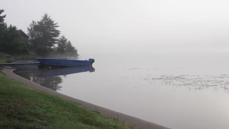 14-foot-Aluminum-Boat-Docked-on-Misty-Mysterious-Morning---Foggy-Lake-Ontario-Canada