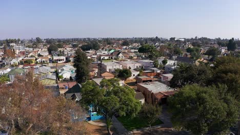 Aerial-rising-and-panning-shot-of-a-South-LA-neighborhood