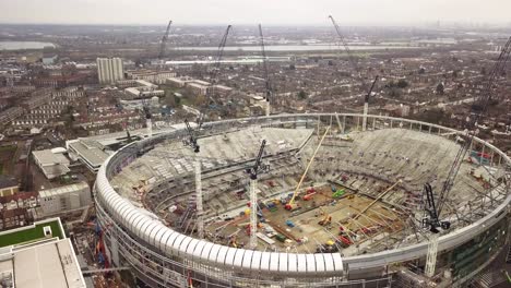 Tottenham-stadium-in-building-process-with-cranes-around-drone-shot
