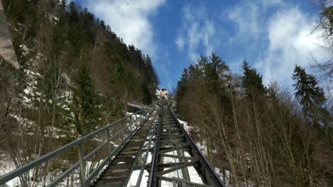 Take-a-lift-with-funicular-for-climbing-a-mountain-in-Hallstatt-Austria