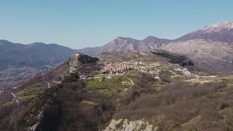 Aerial-panoramic-landscape-view-of-Pietraroja,-an-italian-hill-top-village,-in-the-Apennines
