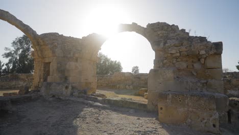 Beautiful-scenic-footage-as-the-sun-shines-through-the-archway-of-an-ancient-Greek-castle