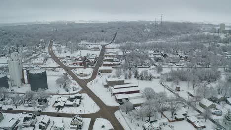 Industrial-side-of-small-county-town-in-aerial-view,-winter-season