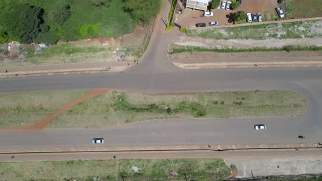 Aerial-view-of-a-highway-road,-with-vehicles-speeding-by,-in-Nairobi,-Kenya