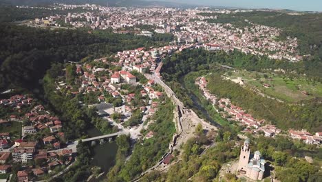 Sideways-movement-drone-shot-of-a-church-on-a-hill-and-the-city-of-Veliko-Tarnovo