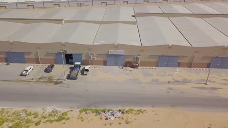 Warehouses-side-by-side-in-the-desert-with-garage-gate-doors-and-a-small-door-next-to-it