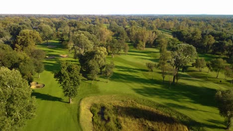 Drone-Shot-Rising-Aerial-Shot-Over-A-Golf-Course