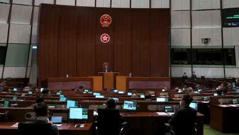 Hong-Kong-lawmakers-are-seen-attending-and-sitting-at-a-meeting-at-the-Legislative-Council's-main-chamber-in-Hong-Kong
