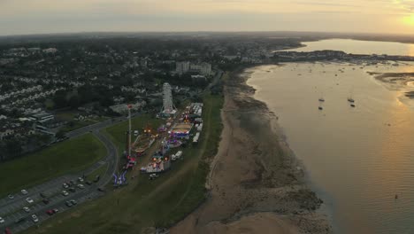 Aerial-4K-pan-of-amusement-park-beside-the-sea