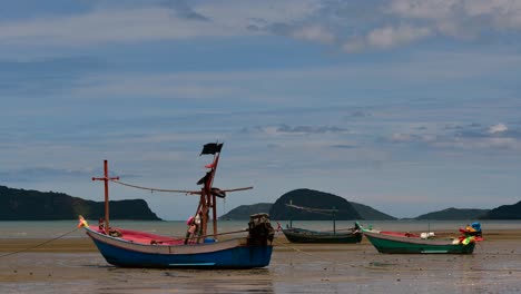 Fishing-Boats-mooring-in-low-tide-are-usually-seen-as-part-of-a-romantic-provincial-seascape-of-Khao-Sam-Roi-Yot-National-Park,-Prachuap-Khiri-Khan,-in-Thailand