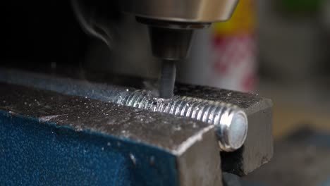 Close-up-of-professional-craftsman-breaking-drill-after-attempting-to-drill-through-hard-steel