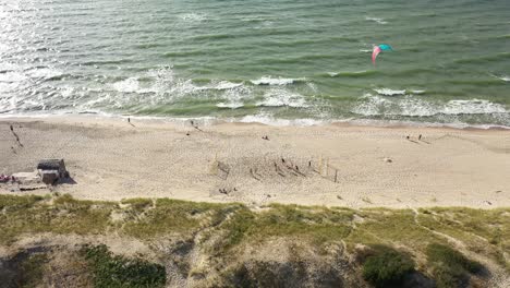 AERIAL:-Flying-Towards-Young-People-Playing-Football-on-a-Sandy-Beach