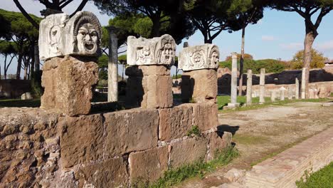 Theater-masks-from-the-decoration-of-the-amphitheater-in-Ostia-Antica,-a-huge-archaeological-site-located-in-Rome