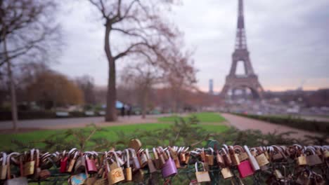 Love-padlocks-in-Paris-with-view-of-the-Eiffel-Tower,-romantic-symbols-in-Paris,-tourism-in-France