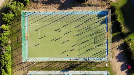 Steady-drone-shot-of-a-field-hockey-from-above