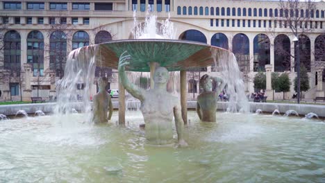 Old-roman-statue-in-a-water-fountain,-looking-like-it's-taking-a-selfie,-roman-architecture-in-Montpellier-in-South-of-France