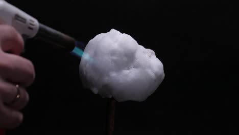 Melting-snowball-with-torch