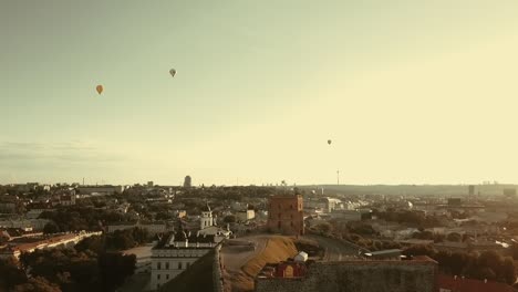 Aerial-view-of-hot-air-balloons-in-the-sky-above-Gediminas-Castle-Tower-and-city-center