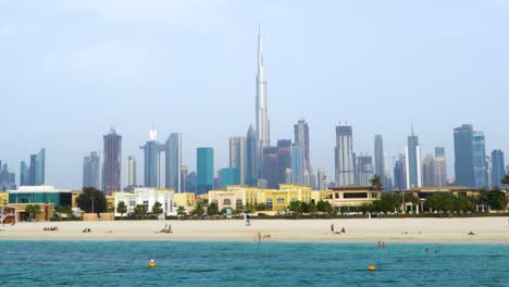 Smooth-steady-pan-up-shot-of-the-Dubai-Skyline-and-beaches-including-the-Burj-Kahalifa
