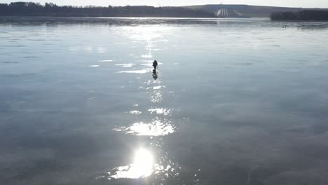 Man-walking-on-tiny-ice-in-spring