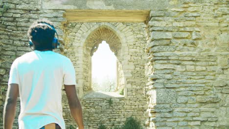 4K-footage-of-black-man-walking-through-the-Ruins-of-St'-Peter's-Church