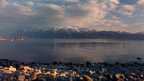Drone's-flight-over-the-Leman-Lake-from-Vevey,-aiming-at-the-french-mountains