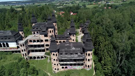 Massive-building-of-Lapalice-castle-in-Poland,-aerial-drone-shot