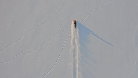 Cinematic-drone-footage-of-snowmobile