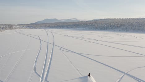 Cinematic-drone-footage-of-snowmobile-acceleration-4k